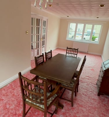 a dining room with freshly painted walls and chandelier