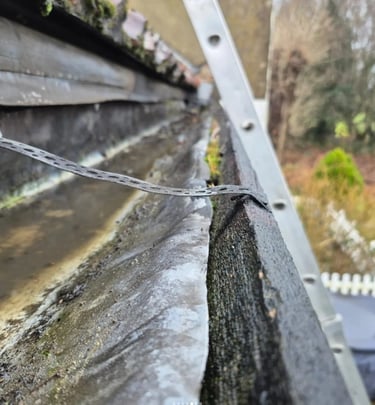 Gutter clearance and debris removal on residential property