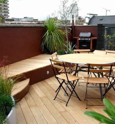 Stylish terrace garden with seating and planters in Bangalore