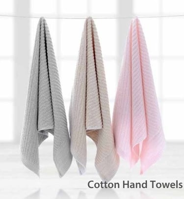 three Cotton Hand towels hanging on a clothes line