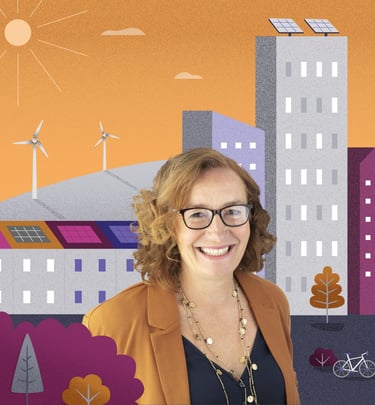 Women sits in front of an illustrated scene of colourful a town with hills and wind turbines.