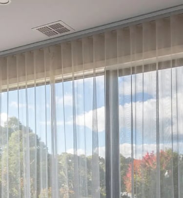 a bed room with a large window and a bed