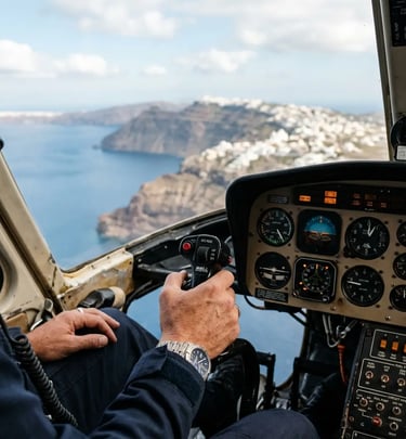 Private pilot hand on Bell 206 cyclic control flying over Santorini cliffs