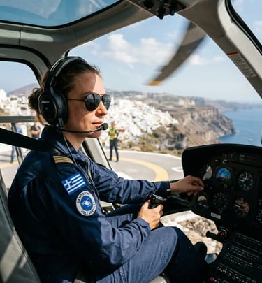 Helicopter pilot in cockpit preparing for departure from Santorini helipad