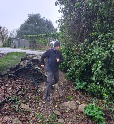 runner descending muddy bank