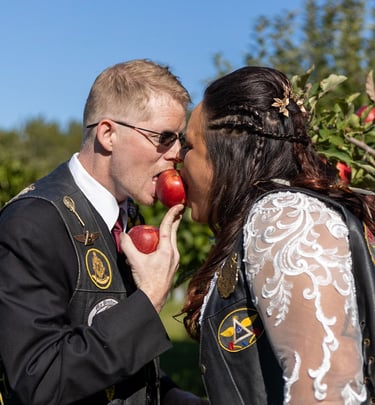 a man and woman kissing in a field