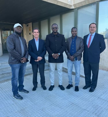 a group of men standing in front of a building