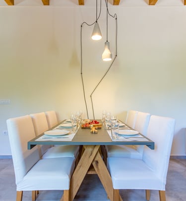 Small dining area for two with ambient lighting at Villa Skyphos