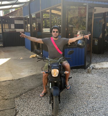Solo traveler riding a comfortable rental scooter near Brasilito beach Costa Rica