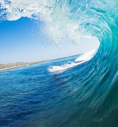 an ocean wave curling over to create a beautiful tube