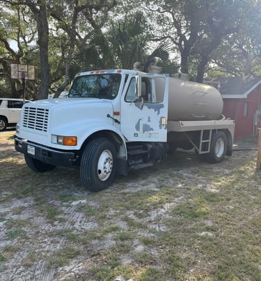 a pump truck pulled up to a home for service