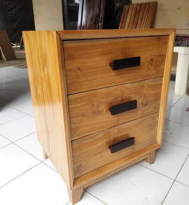 a wooden chest made in bali of drawers with a drawer underneath