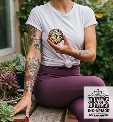 All Natural Tattooed Skin Care - Woman in eggplant yoga pants holds Bee's Ink Armor Daily Care Salve