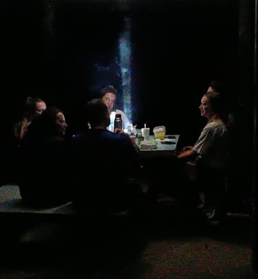 Atmospheric dinner setting for guests staying inside Deramakot Forest Reserve, Borneo