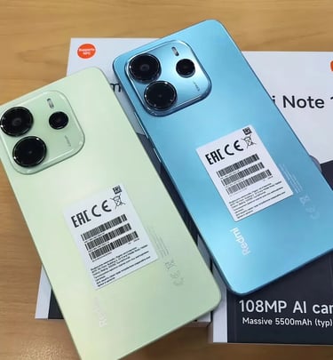 a couple of iphones sitting on top of a box