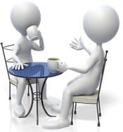 Two friends talking and having coffee.