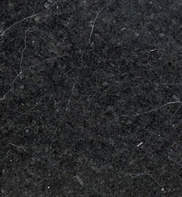 Smooth quartz slabs with warm beige hues and delicate flecks, ready for residential countertops.