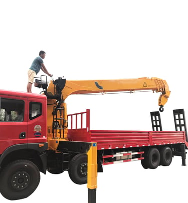 A man standing on top of a 14 ton Telescopic Boom Truck Mounted Crane with 4 section arms.