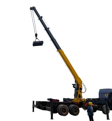 A man standing next to a 10 ton Telescopic Boom Truck Mounted Crane lifting a large object with 5 section arms.