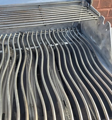 Spotless BBQ grill showing gleaming results after expert cleaning