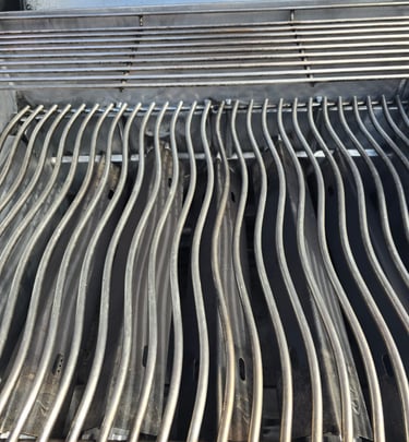 Clean and polished grill grates after professional BBQ cleaning service