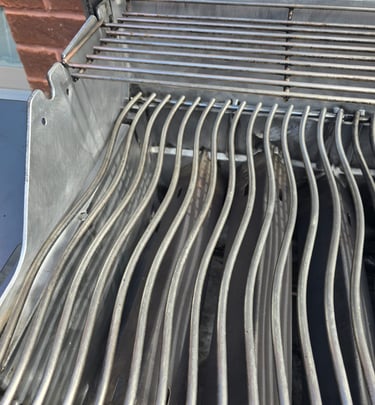 BBQ grill after deep cleaning with restored stainless steel surfaces