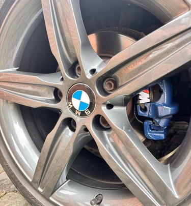 a car wheel with a blue calliper
