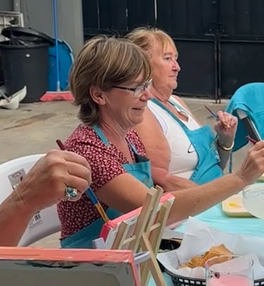 Guests enjoying a paint and sip in Cozumel Mexico