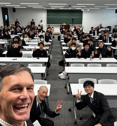 Giving a lecture on recreation to Kyushu Sangyo University
