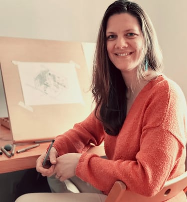 a woman sitting in a chair with a pen