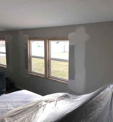 The  windows were removed and drywall has been repaired filling in the hole