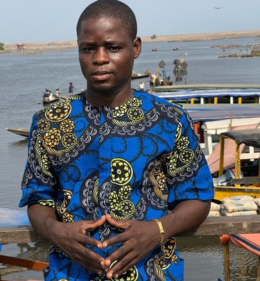 Dahomey African Tours Senior Guide and Tour Planner at Ganvie Stilt Village in Benin