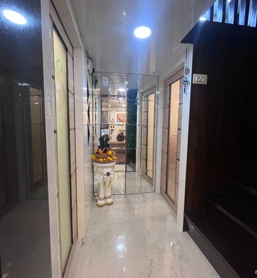 Dr Seema Sheen Aesthetics hallway with a lot of white and black furniture