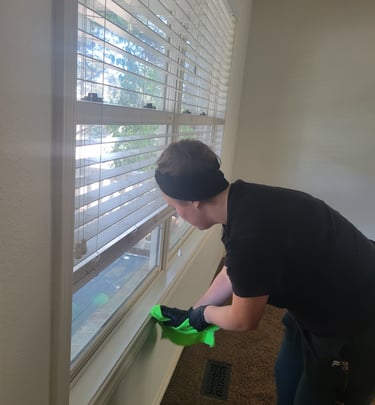 Women cleaning window sill, in move in/ move out King Organic Clean Service