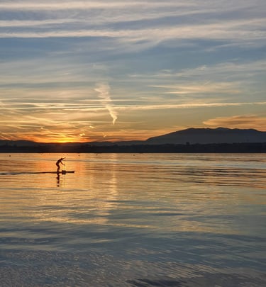 a person is standing on a surfboard in the water