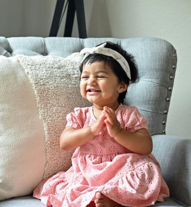 Baby girl posing for the camera on her 1st birthday.
