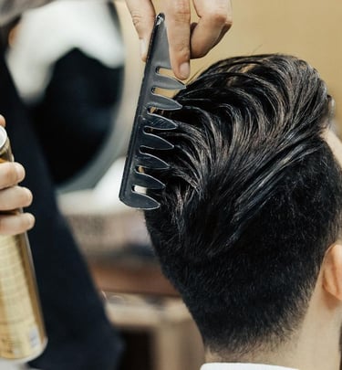 a man with a haircut and a haircut