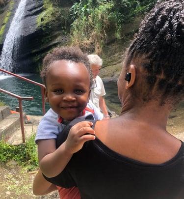 infant and adult at the Concord waterfall
