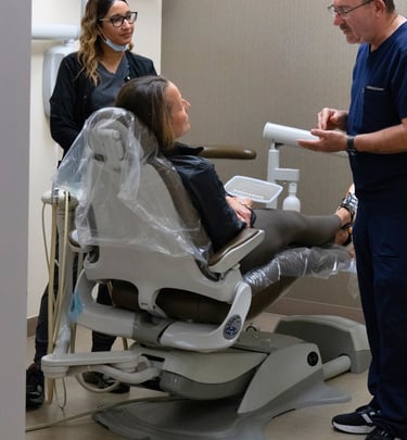 orthodontist consulting with a patient during a dental visit