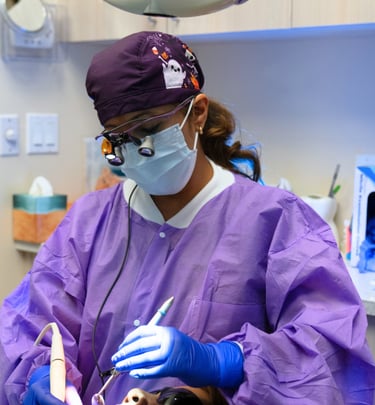 dental hygienist performing a deep cleaning procedure with clinical precision