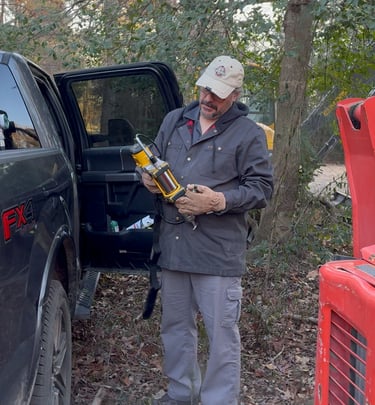 John trying to figure out the new DeWalt grease gun