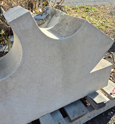 A large architectural limestone carving with biofilm removed by laser cleaning