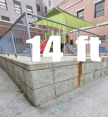 A blank exterior wall in a school play area.