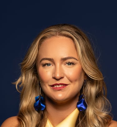 a woman with long blonde hair and blue earrings