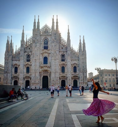 Woman twirling in front of the Duomo di MIlano