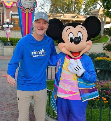 Chris Breedlove pictured with Mickey Mouse at Disneyland® Park.
