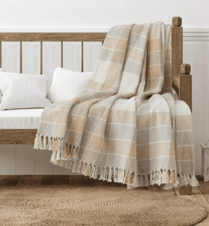 camel and beige plaid blanket throw on bench