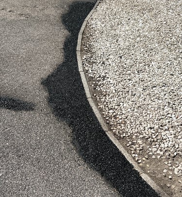 “Close-up of crack repair on a tarmac surface during restoration”