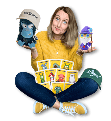 Anne Bagg holding physical Veefriends collectibles like friendscaps, plushies, trading cards, figure