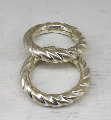 "Bold handcrafted bangle pair with curved tribal design–artificial metal finish-for foreign trade"